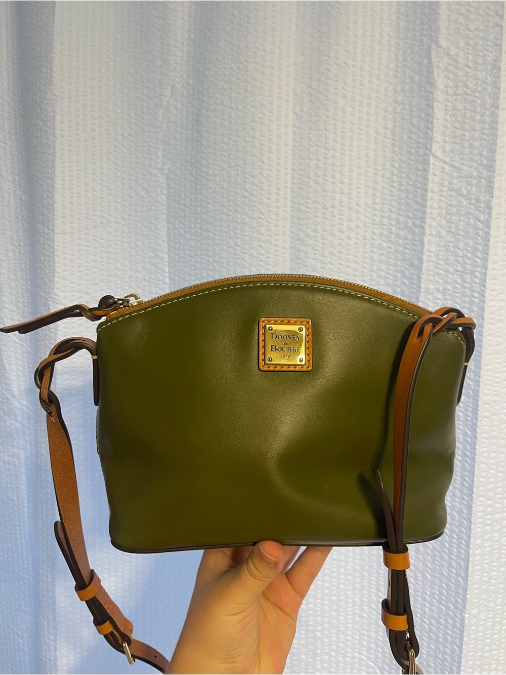 64. Dooney and Bourke purse.
